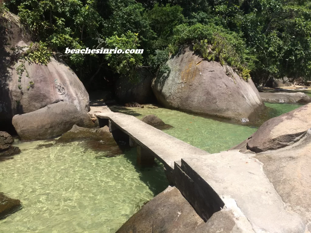 View of Ilha Guaíba Island near Mangaratiba, Rio de Janeiro, surrounded by tropical forest and emerald-green sea, part of the scenic island landscape along Brazil’s Costa Verde.